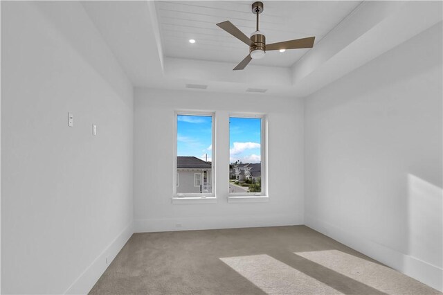950 Surfsedge Way Unit 205, Vero Beach, FL 32963 - carpeted spare room with a raised ceiling and a ceiling fan