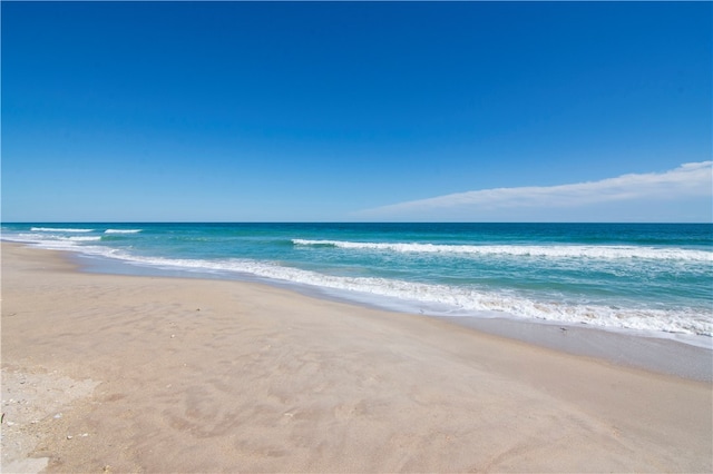 property view of water featuring a beach view