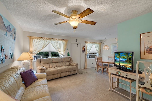 tiled living room with ceiling fan, a textured ceiling, and cooling unit