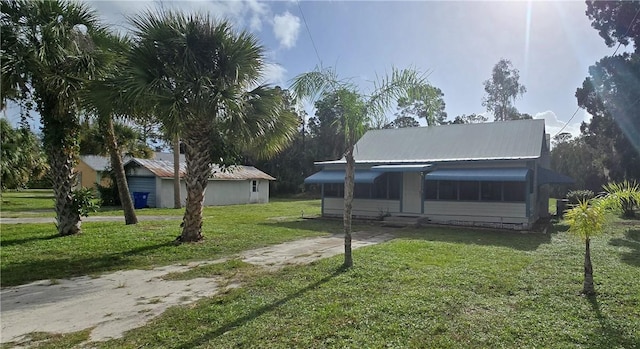 view of home's community featuring a lawn