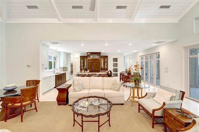 280 Seabreeze Ct, Vero Beach, FL 32963 - living room featuring beamed ceiling, visible vents, recessed lighting, and light colored carpet