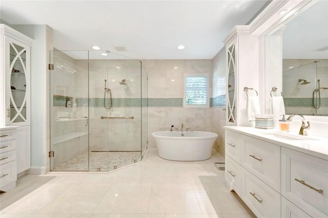 280 Seabreeze Ct, Vero Beach, FL 32963 - bathroom featuring recessed lighting, a stall shower, vanity, and a freestanding tub