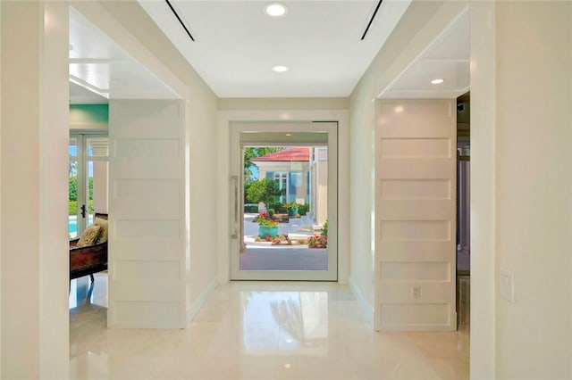 280 Seabreeze Ct, Vero Beach, FL 32963 - corridor with baseboards, a healthy amount of sunlight, and recessed lighting