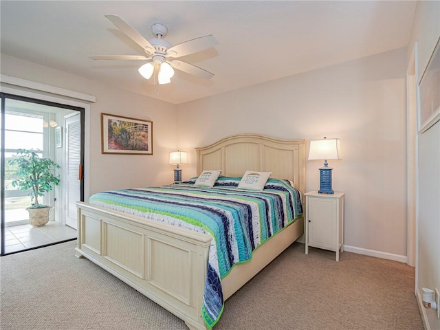 bedroom featuring access to outside, light colored carpet, ceiling fan, and baseboards