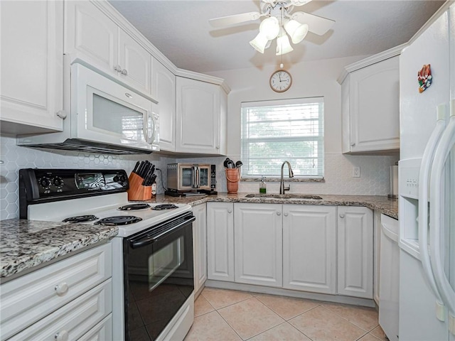 kitchen with white cabinetry and white appliances