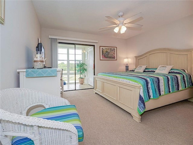 bedroom featuring access to exterior, a ceiling fan, and light colored carpet