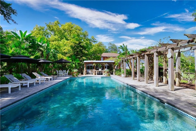 315 62nd Ct SW, Vero Beach, FL 32968 - community pool featuring a pergola and a patio