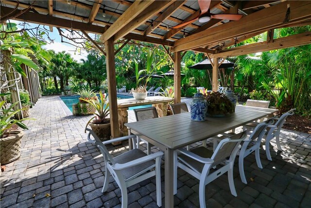 315 62nd Ct SW, Vero Beach, FL 32968 - view of patio featuring a ceiling fan, an outdoor pool, and outdoor dining space