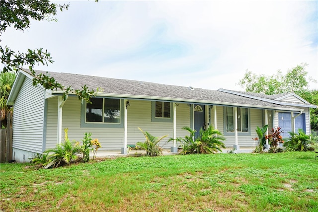 single story home with covered porch and a front lawn