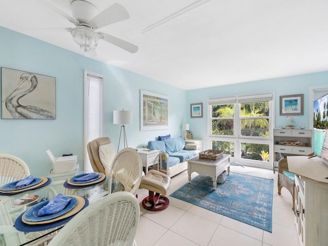 living room with ceiling fan and light tile patterned floors