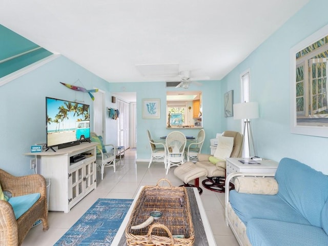 living room with ceiling fan and light tile patterned floors