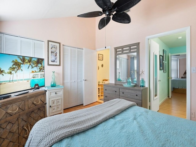 bedroom featuring vaulted ceiling, ceiling fan, and light wood-type flooring