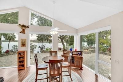 sunroom with ceiling fan and lofted ceiling