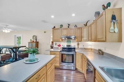 kitchen with dark wood-type flooring, ceiling fan, appliances with stainless steel finishes, and light brown cabinetry