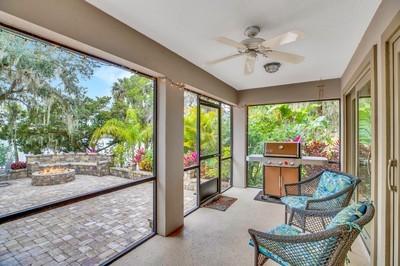 sunroom / solarium with ceiling fan and a healthy amount of sunlight