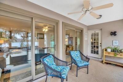 sunroom / solarium with ceiling fan