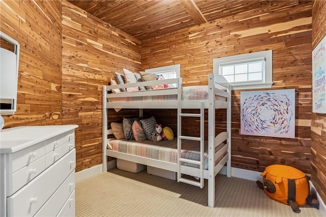 bedroom with wood walls and wooden ceiling