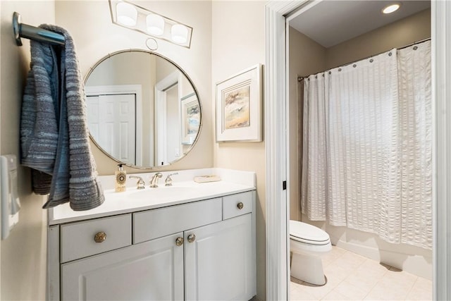 bathroom featuring tile patterned floors, toilet, and vanity