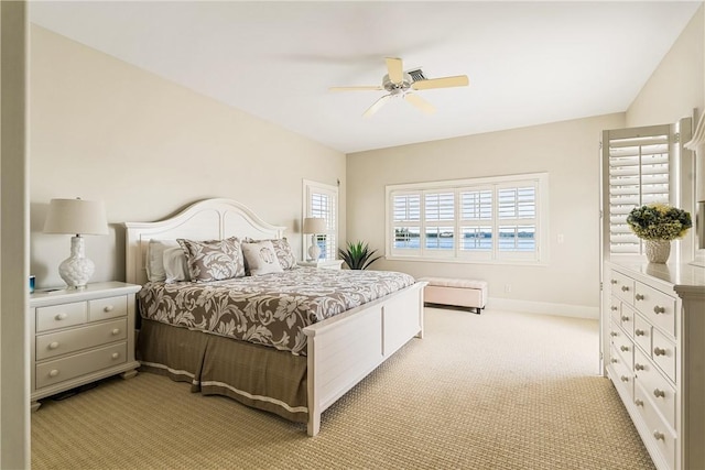 carpeted bedroom featuring ceiling fan