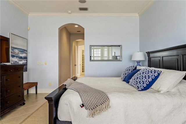 tiled bedroom featuring crown molding