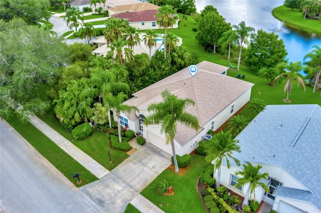 birds eye view of property with a water view