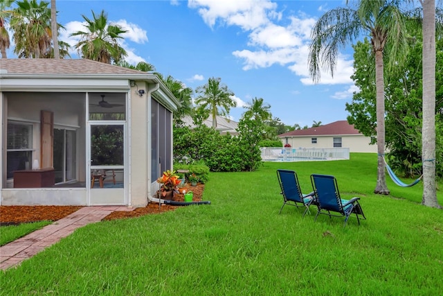 view of yard with a sunroom