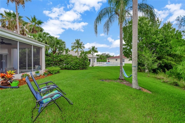 view of yard with a sunroom