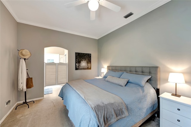 carpeted bedroom with crown molding and ceiling fan