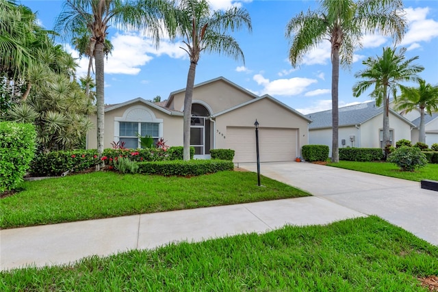 ranch-style house with a garage and a front yard