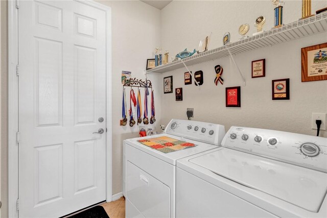 laundry area with washer and clothes dryer