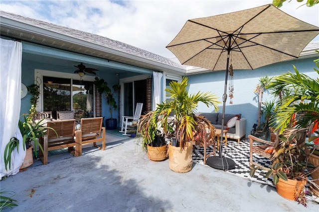 view of patio featuring an outdoor living space and ceiling fan