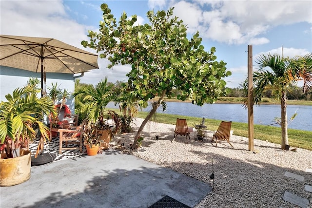 view of patio with a water view