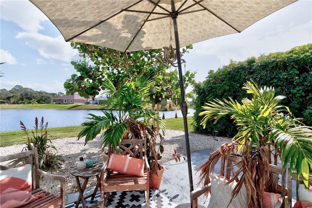 view of patio with a water view