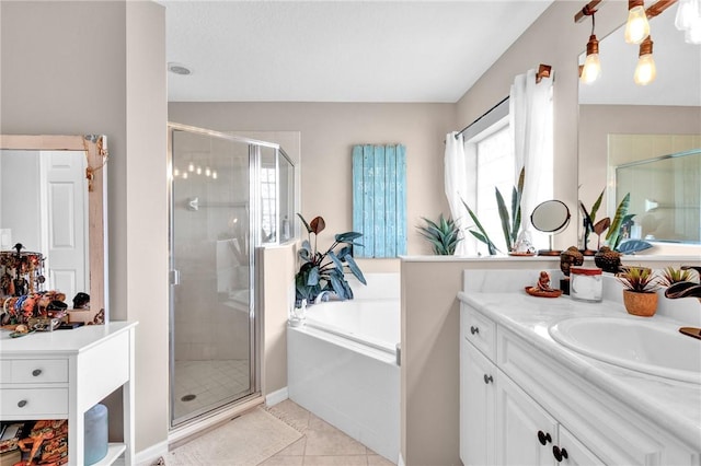 bathroom with tile patterned floors, vanity, and independent shower and bath