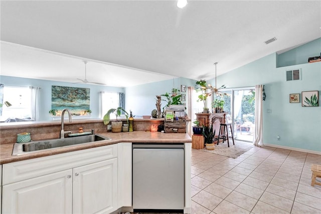 kitchen with dishwasher, a healthy amount of sunlight, lofted ceiling, and sink