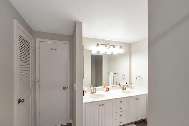 5060 Harmony Cir Unit 307, Vero Beach, FL 32967 - full bathroom featuring double vanity and a closet