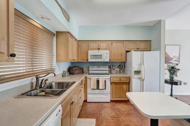 5060 Harmony Cir Unit 307, Vero Beach, FL 32967 - kitchen with white appliances, a sink, light countertops, tile patterned flooring, and light brown cabinets