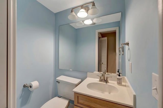 5060 Harmony Cir Unit 307, Vero Beach, FL 32967 - half bath featuring toilet and vanity