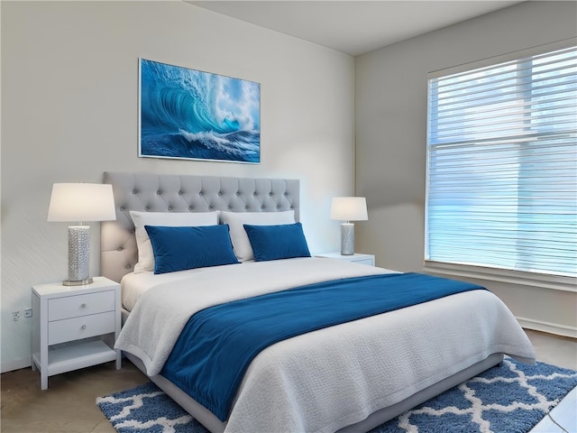bedroom featuring baseboards