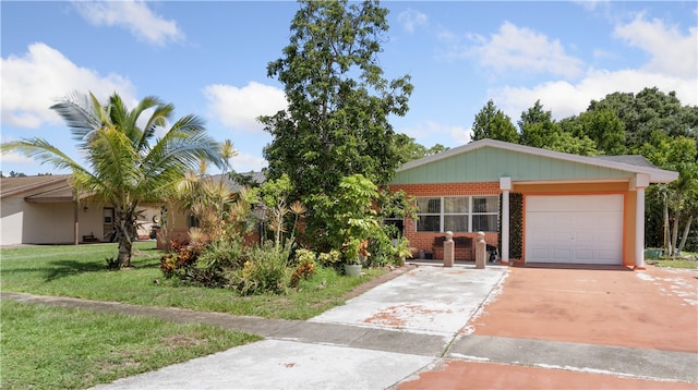 ranch-style home with a front lawn and a garage