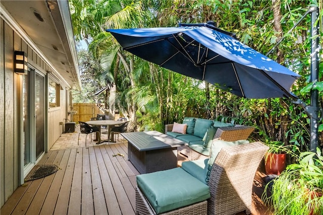 wooden terrace featuring an outdoor living space