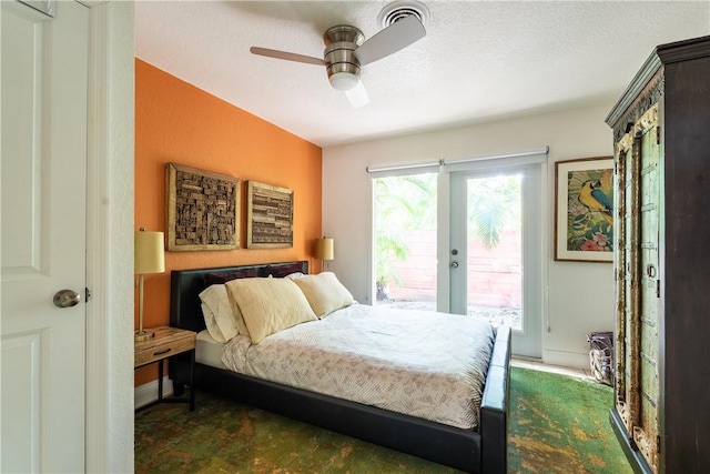 bedroom featuring ceiling fan, a textured ceiling, access to outside, and french doors