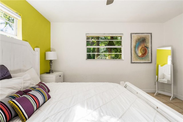 bedroom with tile patterned floors and ceiling fan