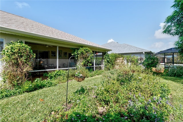 view of yard featuring a sunroom