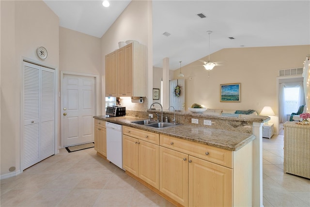 kitchen featuring light tile patterned flooring, sink, kitchen peninsula, light brown cabinets, and dishwasher