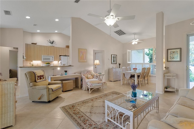 tiled living room with high vaulted ceiling and ceiling fan