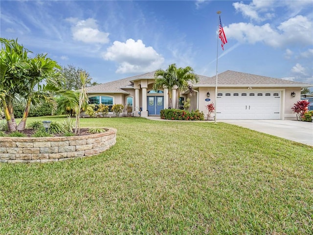 view of front facade with a front yard and a garage