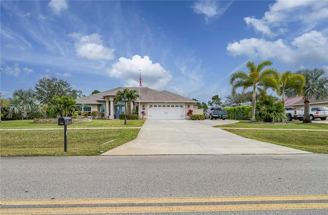 view of front of property featuring a garage and a front yard