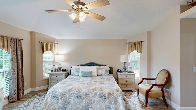 bedroom featuring multiple windows and ceiling fan