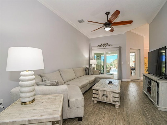 living room with ceiling fan, dark hardwood / wood-style flooring, crown molding, and lofted ceiling